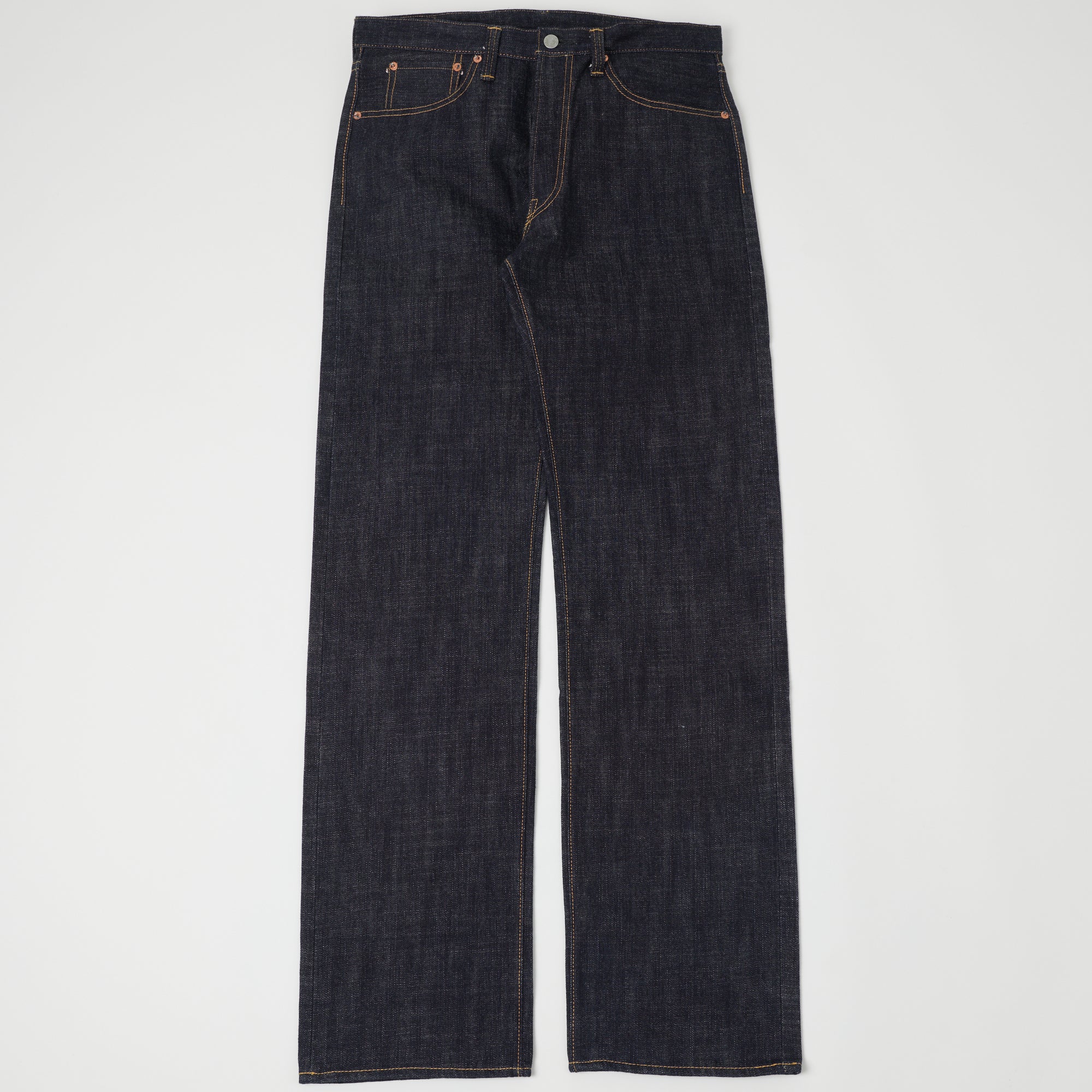 A pair of raw selvedge jeans shown flat from the front.