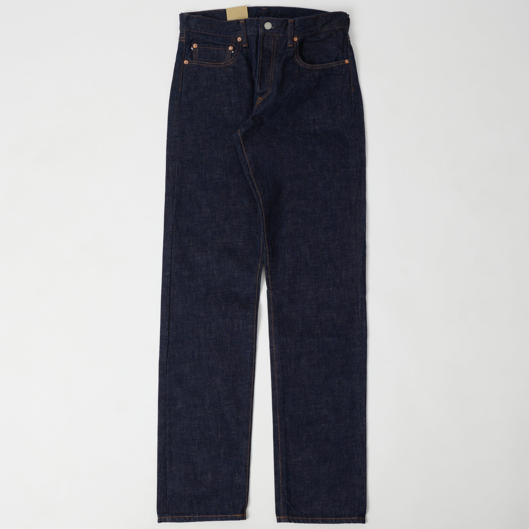 A pair of raw selvedge jeans shown flat from the front.