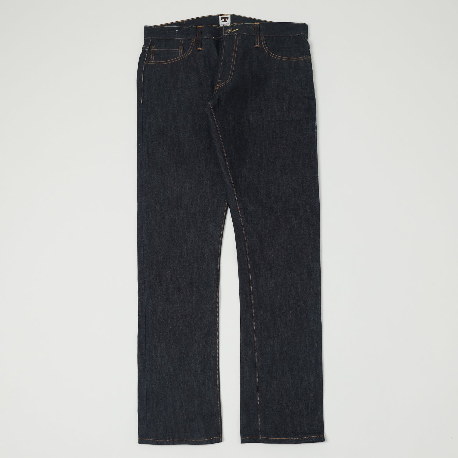 A pair of raw selvedge jeans shown flat from the front.