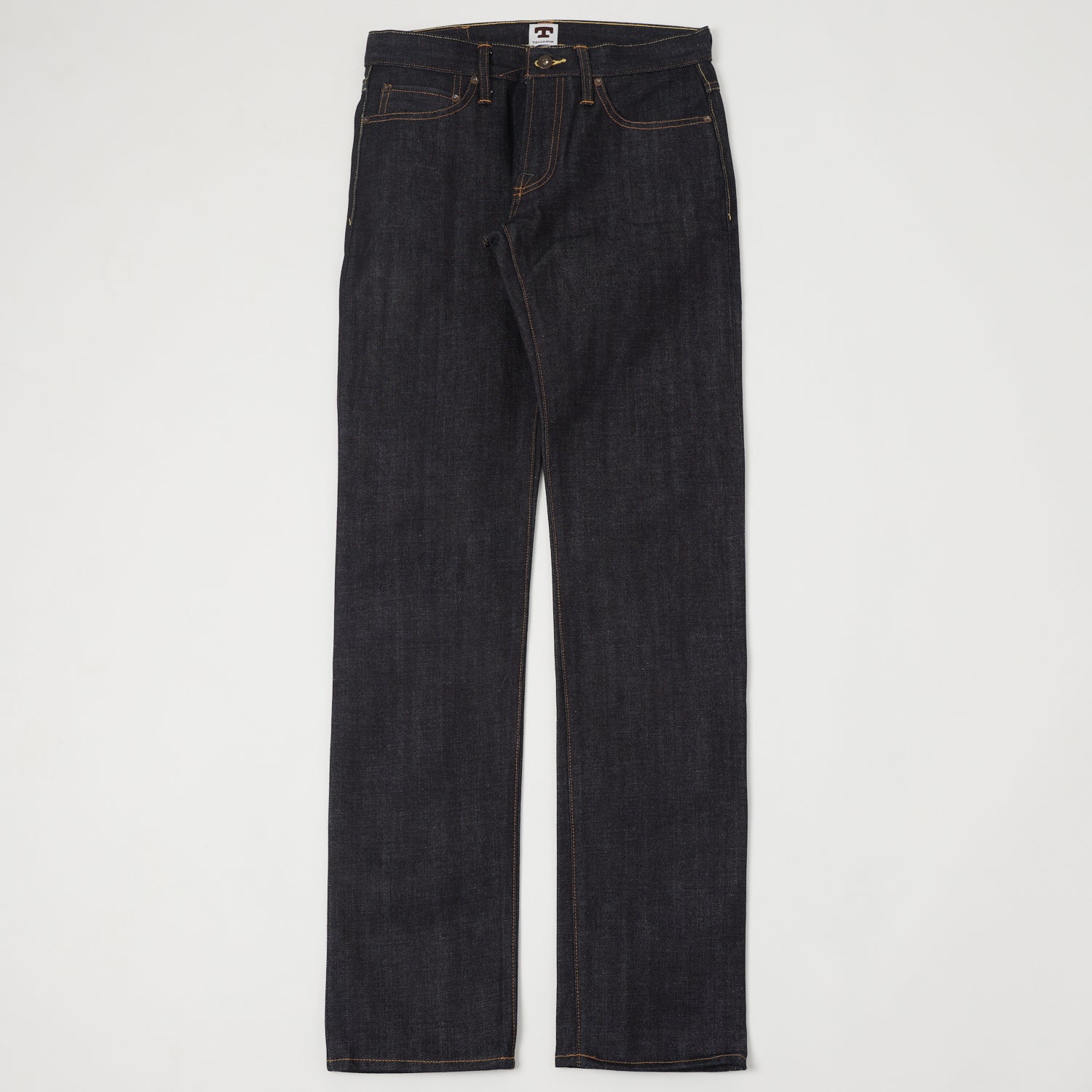 A pair of raw selvedge jeans shown flat from the front.