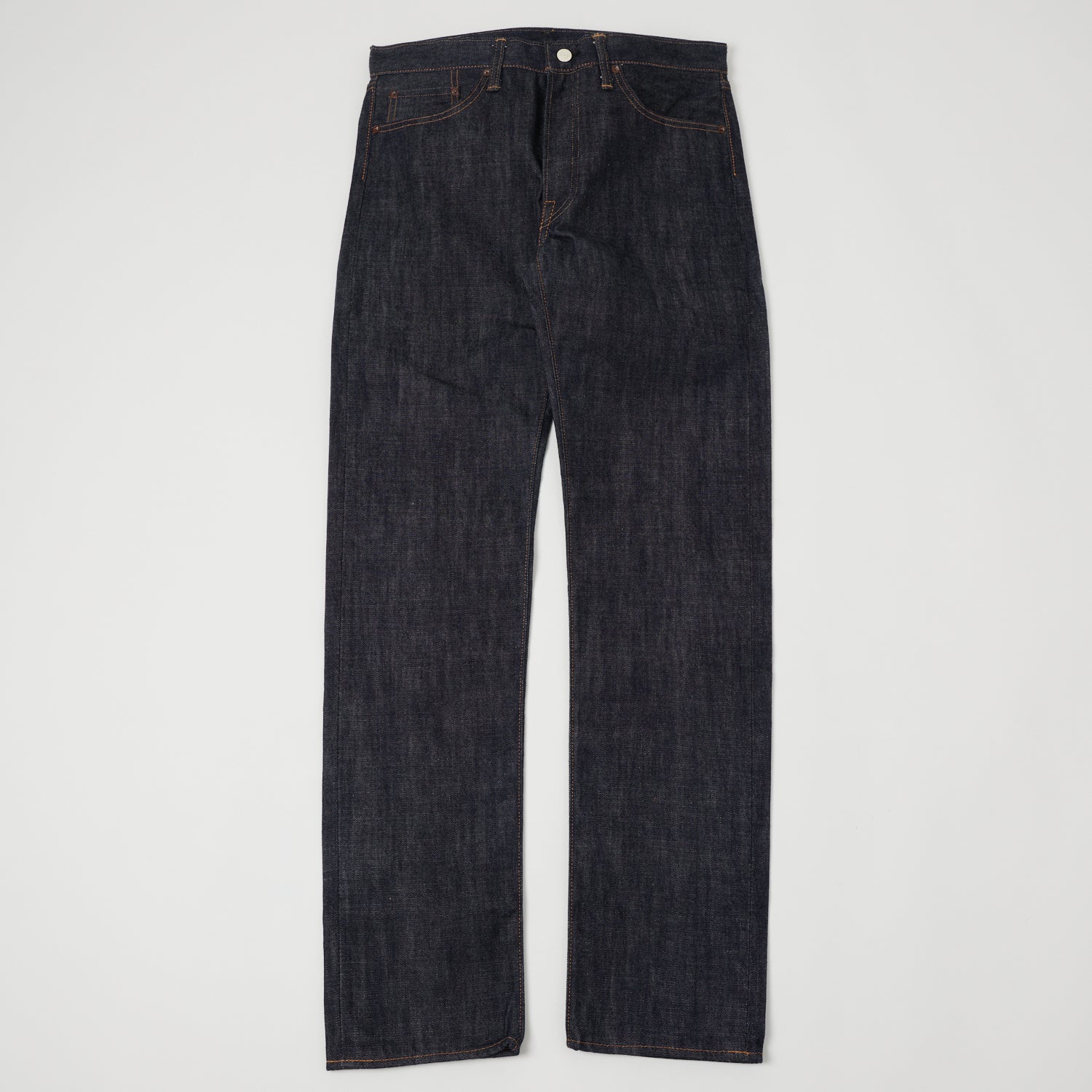 A pair of raw selvedge jeans shown flat from the front.